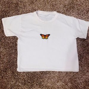 This is a brandy top it’s white with butterfly in the middle!!